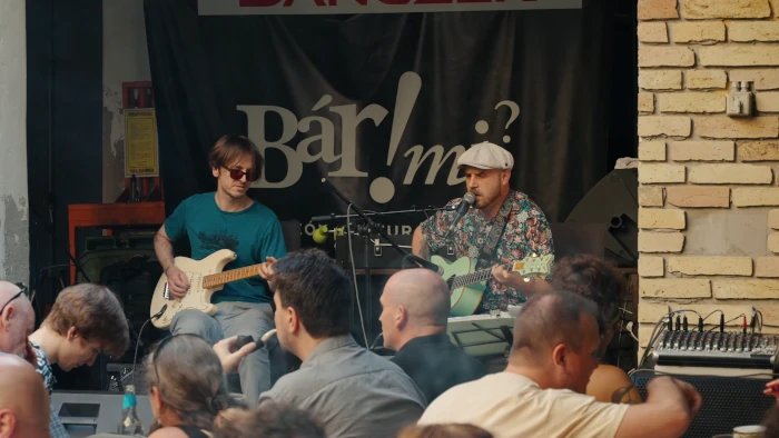Band playing on the outdoor stage for the audience
